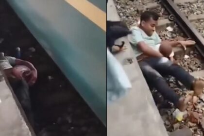 πατέρας ασπίδα βρέφος στις ράγες Bhairab