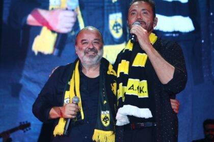 Χρήστος Μενιδιάτης με κιτρινόμαυρο κασκόλ στην πίστα