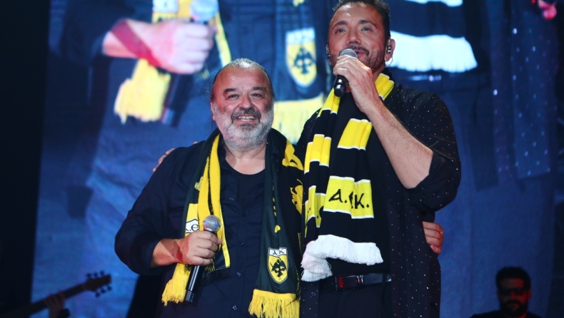 Χρήστος Μενιδιάτης με κιτρινόμαυρο κασκόλ στην πίστα